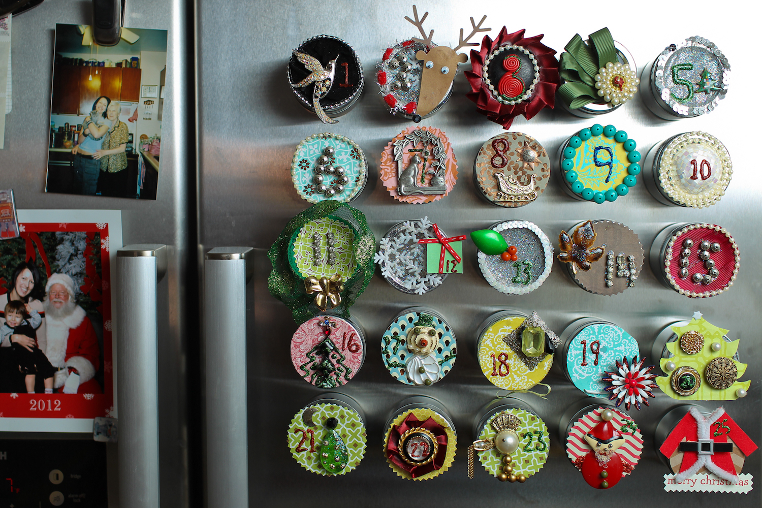 Hand made advent calendar with beads and ribbons glued to make holiday scenes.